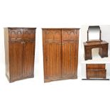 A 1930s oak four piece bedroom suite with linen fold decoration.