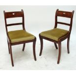 A set of four late 19th/early 20th century Regency style mahogany bar back dining chairs on sabre