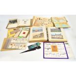 A collection of assorted ephemera including stamps, postcards, royal commemorative memorabilia.