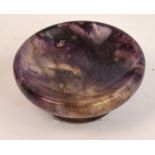 An early 20th century turned Blue John miniature shallow bowl, diameter 4.5cm, height 1.6cm.