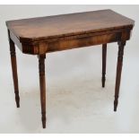 A Georgian mahogany foldover tea table with canted corners,