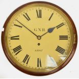 An early 20th century mahogany circular wall clock with circular repainted dial set with Roman