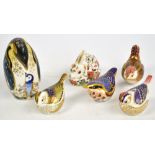 Six Royal Crown Derby paperweights; penguin (silver plug), meadow rabbit (gold plug), wren (gold