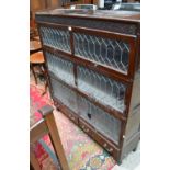 An early 20th century oak Globe Wernicke style three section stacking bookcase with lead glazed up