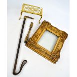 A brass trivet, a gilt picture frame, a riding crop with antler handle,