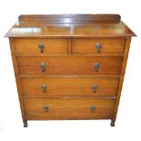 A 1930s oak chest of drawers.