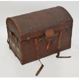 A canvas covered domed travelling chest with leather corners, straps and handles,