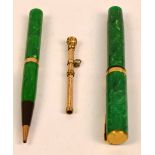 A 1920's Canadian Waterman's Ideal pen and nib with yellow metal self filling mechanism and mounts,