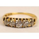 An 18ct yellow gold five stone diamond ring, the graduated stones set into a pierced gallery,