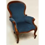 A Victorian mahogany spoon backed salon chair with knee carved cabriole front legs (one back leg