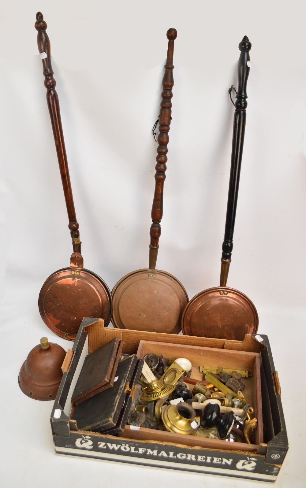 Three copper warming pans, a copper posser head,