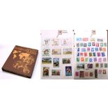 A Stanley Gibbons International stamp album containing a quantity of largely 20th century British