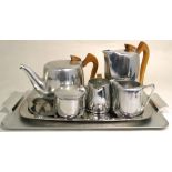 A Picquot Ware three piece tea service on unrelated tray and a Canadian tray decorated with a