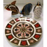 Three Royal Crown Derby paperweights, two in the form of fish and one in the form of a penguin, also