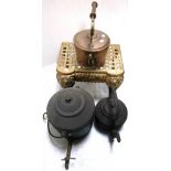 A brass fireside seat, an engraved copper kettle, a large black metal pot and kettle (4).