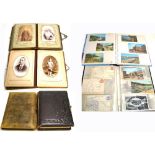 Two Victorian photograph albums containing photographs and cabinet cards and two folders of