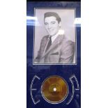 A framed print of Elvis Presley with a panel in the form of a record,