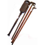 A early 20th century seat stick, two 20th century brass handle canes,