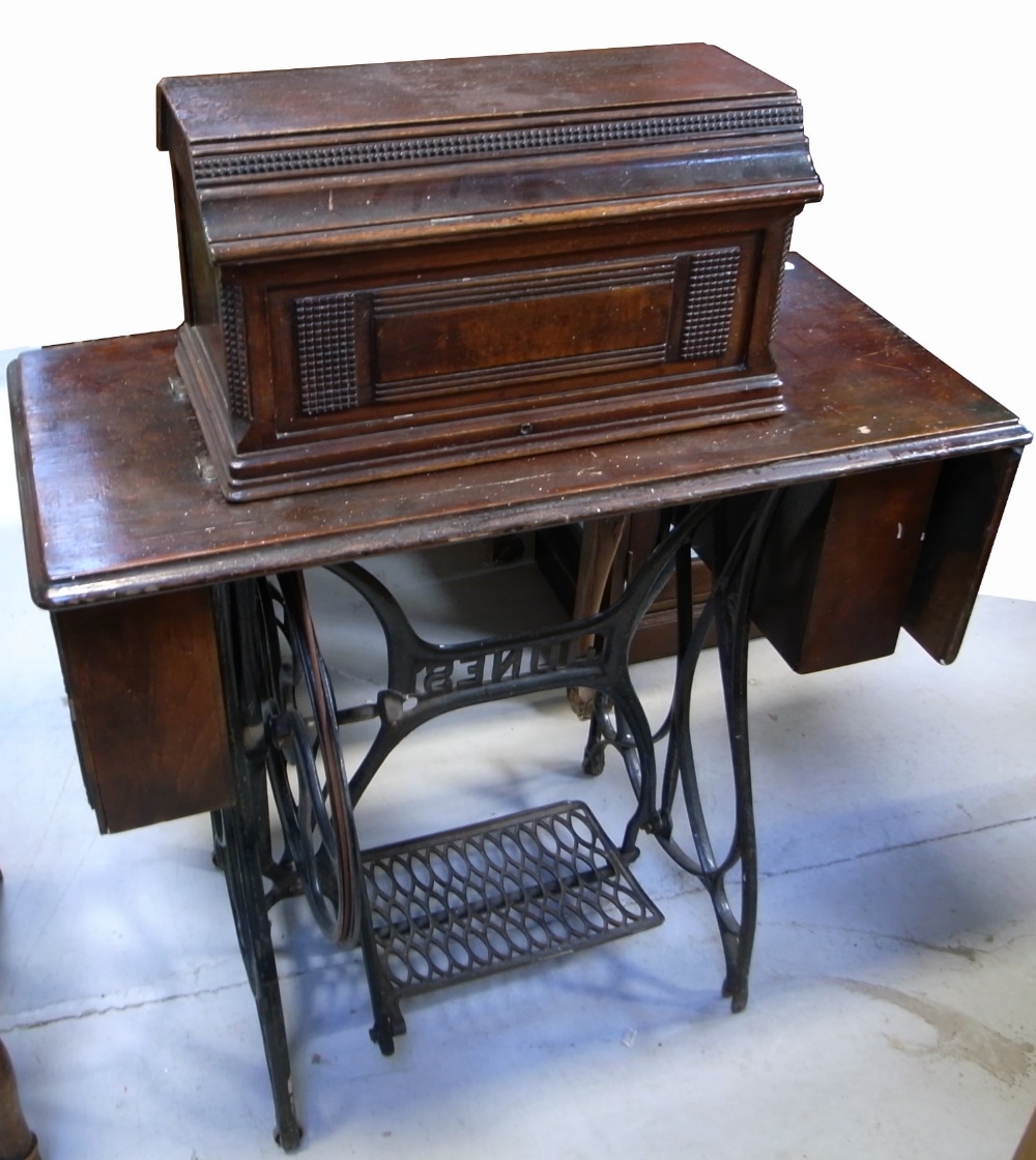 An early 20th century Jones treadle sewing machine, width 85cm.