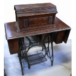 An early 20th century Jones treadle sewing machine, width 85cm.