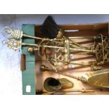 A quantity of brass ware to include to include a set of fireside irons, a boot etc.