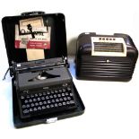 A vintage brown bakelite Bush radio and a New Royal Quiet Deluxe portable typewriter (2).