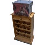 A contemporary pine wine cabinet, one short drawer above shaped plinth base,