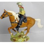 A Beswick figurine of a mounted cowboy, no.1377, height 23cm. CONDITION REPORT Slight blurring of