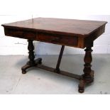 A Victorian dining table base with turned baluster supports on bun feet with later top and further