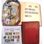 Two albums and a tin containing a quantity of largely 20th century British and World stamps and a