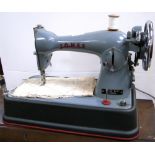 A cased Jones C.B. Model D-65 sewing machine.