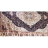 A tan ground Keshan rug, 190 x 140cm.