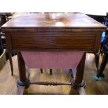 A 19th century rosewood sewing table with fold over top and pillar supports, width 61cm.