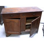 A late 19th early 20th century oak sideboard on bracket feet,