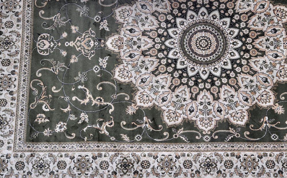 A green ground Tabriz carpet, 280 x 200cm.