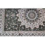 A green ground Tabriz carpet, 280 x 200cm.
