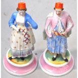 A pair of 19th century Continental hand painted figurines, probably German,