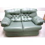 A contemporary green leather two seat sofa with button back, width approx 150cm.