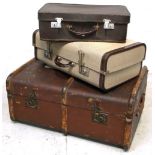 A 20th century leather and wooden bound travelling trunk with brass fittings and two vintage