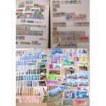A good collection of world stamps comprising four albums,
