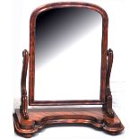 A Victorian mahogany swing mirror.