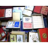 A quantity of playing cards, the majority boxed.