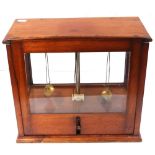 A 19th century set of mahogany cased Sone of Gloucester Street, London chemists scales.