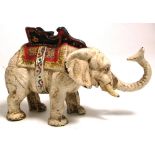 A late 19th century novelty money box modelled as a white elephant with Howdah.