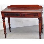 A Victorian hall table on turned legs, two drawers to the top.