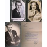 A postcard album containing a selection of signed promotional photographs of film stars of the