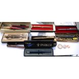 A quantity of pens to include a Parker Junior black bodied fountain pen,