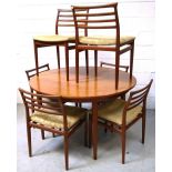 A retro G Plan extending dining table with two spare leaves and a set of six matching chairs,