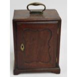 A 19th century mahogany table top cabinet with brass swing carry handle above single door enclosing