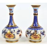 A pair of late 19th century MacIntyre Moorcroft Aurelian ware vases of baluster form with gilt